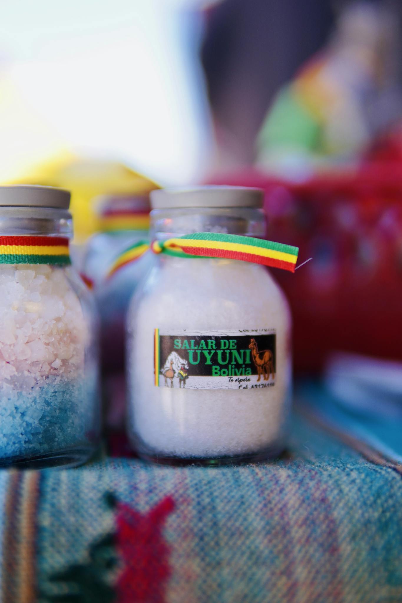 Vibrant close-up of Bolivian salt jars from Salar de Uyuni market.