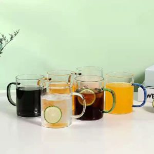 Plain glass cup with coloured handle in box